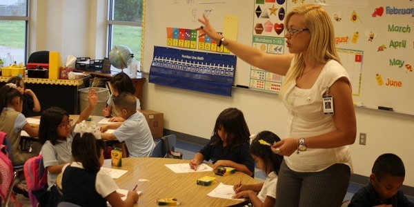 Female teacher instructing class