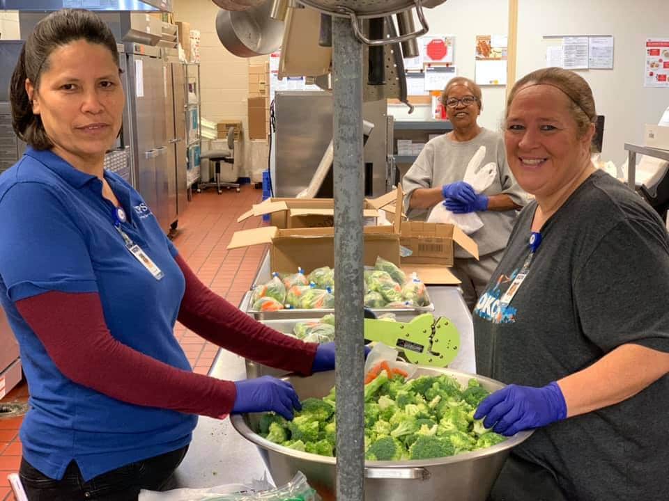 OKCPS kitchen staff preparing vegetables