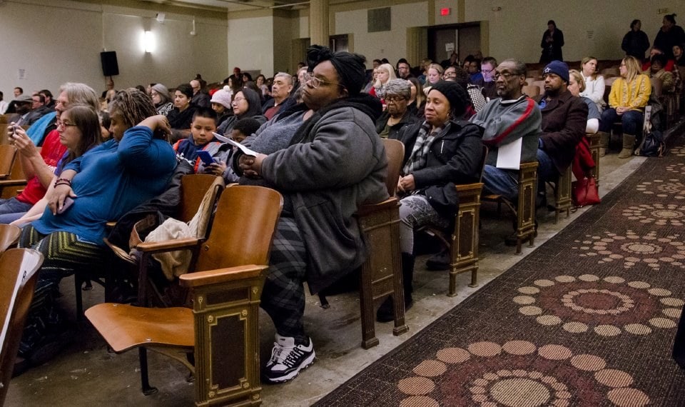 people sitting in an auditorium