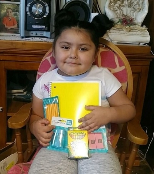 student with school supplies