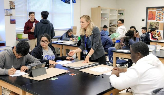 teacher instructing students in class
