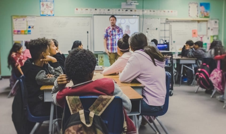 teacher standing in front of class